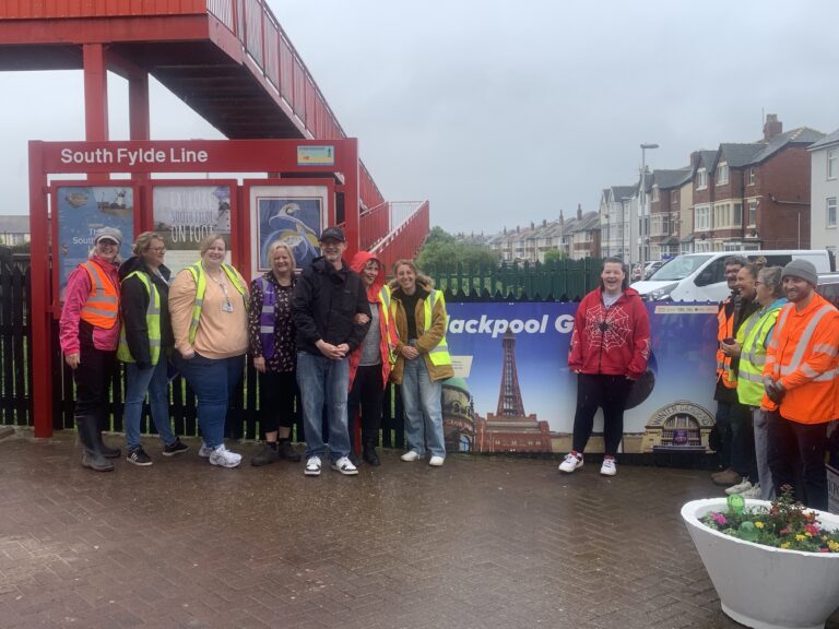 Community clean up team at Blackpool Pleasure Beach Train Station